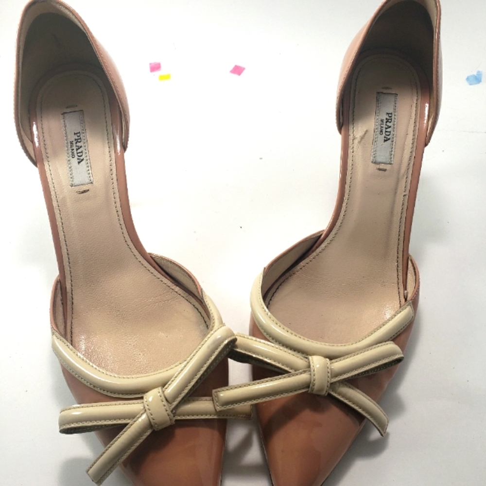 Pink Prada Heels With a Cream Colored Bow on The Toe